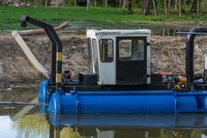 Dredging Machine in a Wetland Environment for Sediment Removal and Waterway Maintenance photo