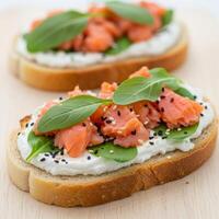 Delicious smoked salmon toasts with cream cheese and greens. Perfect for breakfast, brunch, or healthy snack concepts. photo