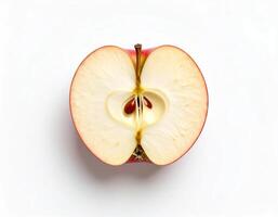 An apple cut in half with a bite taken out photo