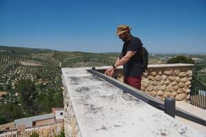 Man Exploring Historical City with Scenic Mountain Vineyard View photo