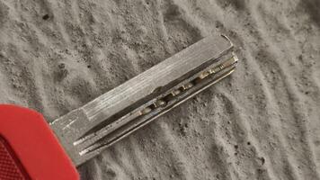 Close-up of a Key's Teeth and Handle on a Textured Surface. photo