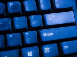 Close-up View of a Dusty Blue Computer Keyboard photo