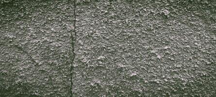 Textured Gray Wall with Vertical Crack, Detailed Close-Up Surface photo