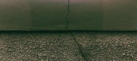 Textured Surface with a Vertical Crack, Abstract Composition and Dark Tones photo