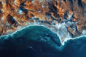 Ocean waves crashing on rocky coastline, scenic aerial view of nature's power photo