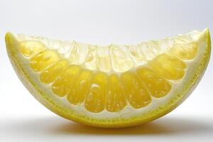 Slice of pomelo fruit showing segments and vesicles on white background photo