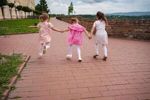 Joyful children exploring Petrovaradin fortress grounds photo