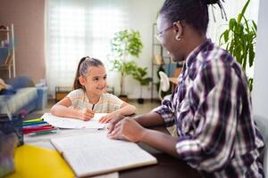 Inspiring moments between a tutor and student in a bright study space photo