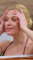 Blissful woman relishing a rejuvenating soak in a bubbling jacuzzi video