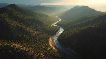 Aerial View of a Winding River Through a Mountain Valley at Sunset photo