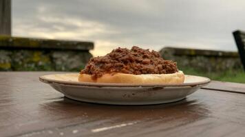 A plate of chili on a table photo