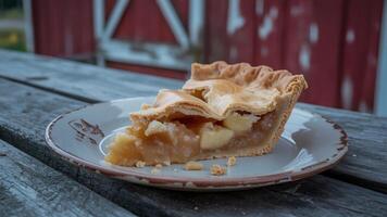 A slice of apple pie on a plate photo