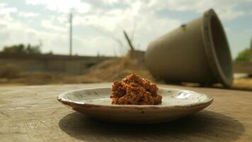 A small plate with food on it sitting on a table photo