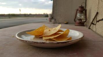 A plate of chips sitting on a table photo