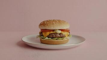 A single burger with cheese and tomato on a plate against a pink background in a studio shot photo