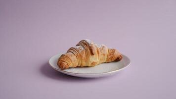 a pie crust with the words pie crust written on it in chocola te on a white pla te on a purple ba ckground photo
