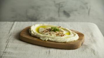 a bowl of chicken ra men with egg a nd sca llions on a white counter in a modern kitchen setting view photo