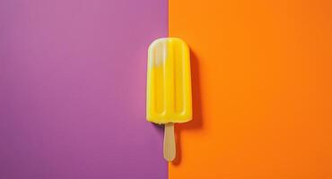 A yellow and orange popsicle on a purple and orange background photo