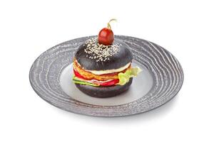 Burger with black bread isolated on white photo