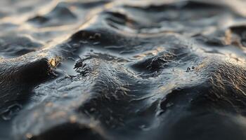 Close up view of textured dark liquid surface patterns photo
