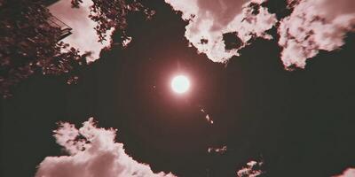 Red Sun and Clouds Low Angle View Dramatic Sky photo