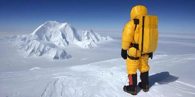 Climber in Yellow Suit Summit Snow Mountain Landscape photo
