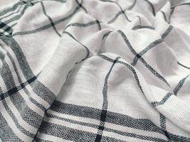 black striped white napkin that is tattered photo
