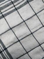a close up of a black and white checkered fabric photo