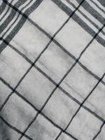 a close up of a black and white checkered blanket photo