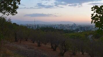 Timelapse scenic Tajikistan capital Dushanbe panorama from popular hilltop Victory park viewpoint with Tv tower, landmarks, buildings, real estate property development video
