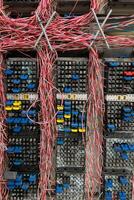 Telephone cross connection box. Fiber optical network cables panel photo