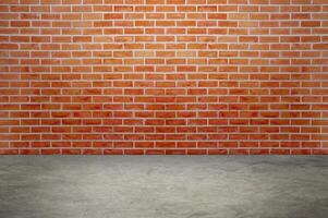 An empty room with red brick walls. The red brick walls create a warm atmosphere. photo