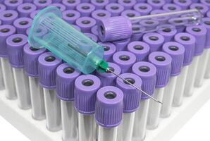 Casette with vacuum test tubes for blood collection and vacutainer one use needle holder photo