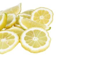 Heap of fresh lemon slices on white background photo