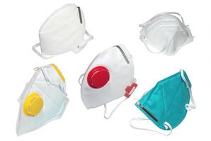 Different types of medical protective masks and respirators on white background photo