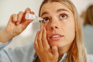 Applying Eye Drops for Eye Relief and Hydration to Improve Comfort and Clarity in Vision photo