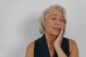 A Thoughtful Senior Woman is Reflecting with Grace and Poise on Lifes Many Aspects photo