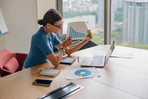 Participating in a Business Meeting with Data Analysis in a Modern Office Environment photo
