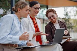 Collaborating effectively as a team in a modern workspace environment is crucial to success photo