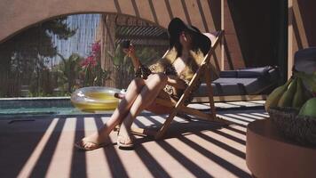 Girl Relaxing by the Pool at a Cozy Greek Villa in Nikiti Tranquil Summer Vacation Scene video
