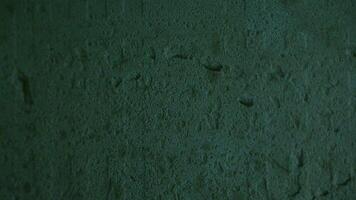 Concrete wall with flickering light and texture, as a background or overlay template video
