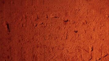 Orange textured background with a flickering fire reflection, creating a warm and dynamic ambiance video