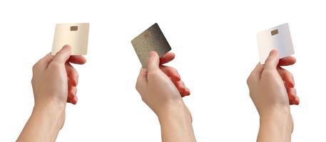 Hand extending a bank card for payment, fingers outstretched, showing credit or debit transaction. photo