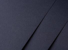 Dark blue matte paper texture with an elegant, premium finish, featuring simple geometric lines and photo