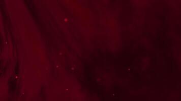 Sombrio vermelho fundo com abstrato padrões e luz partículas. uma rico e dinâmico pano de fundo com sutil brilhar video