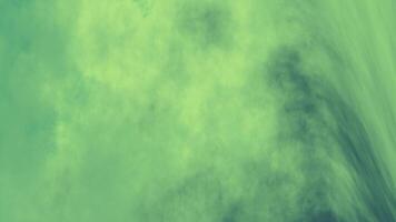 green background with fluid cloud patterns. Ideal for natural or serene designs video