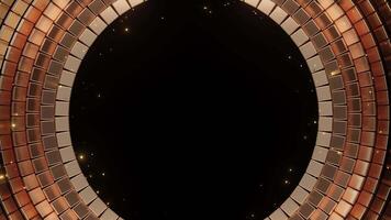Abstract golden circle frame made of shimmering squares with small bright particles floating on a dark background, ideal for event opener, festive holiday, or luxury title background. video