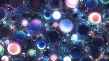 Abstract background features shimmering iridescent spheres or bubbles of various sizes reflecting light and color against a dark backdrop, creating a dynamic visual texture. video