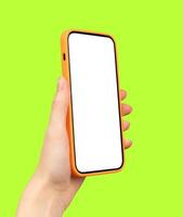 Hand holding a smartphone, displaying a blank screen. A mockup of a mobile device, highlighting photo