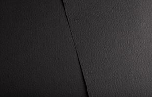Black matte paper texture with a premium, elegant finish, featuring an abstract, geometric design. photo